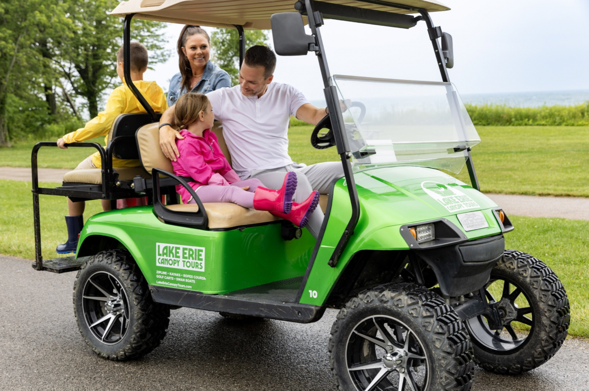 Family on golf cart.